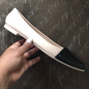 Nude and black patent leather slides